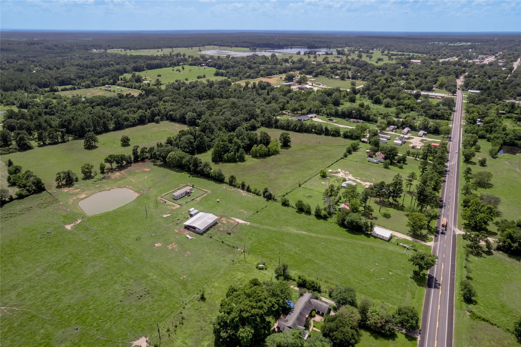 998 East 1st Street Groveton, TX 75845 - Photo 25 of 25 an aerial view of a house with a yard