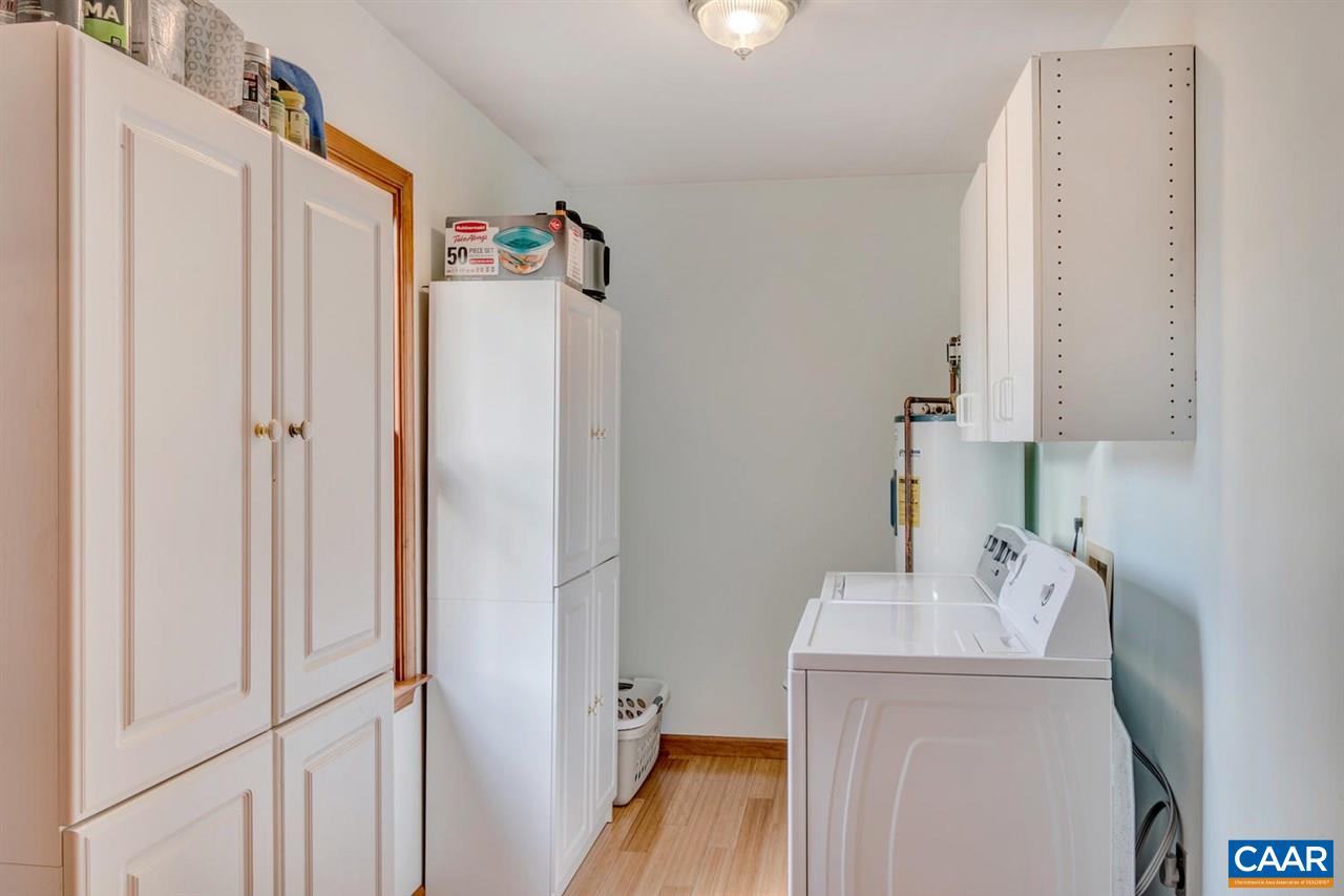 66 Laguna Road Palmyra, VA 22963 - Photo 13 of 50 a bathroom with a sink a toilet and a mirror