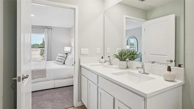 a en suite bathroom with a sink and a mirror