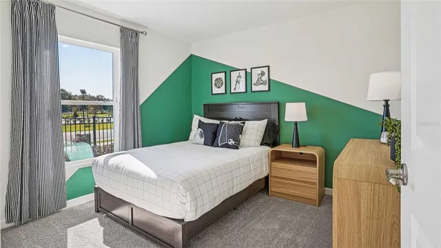 a bedroom with a bed and window