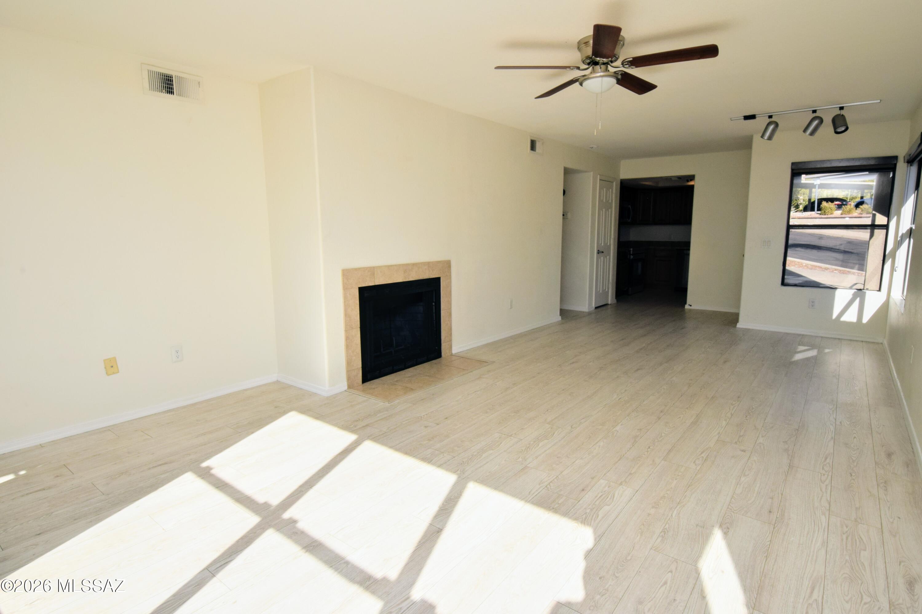 5855 North Kolb Road, Unit 11106 Tucson, AZ 85750 - Photo 6 of 36 a view of a hallway with a kitchen