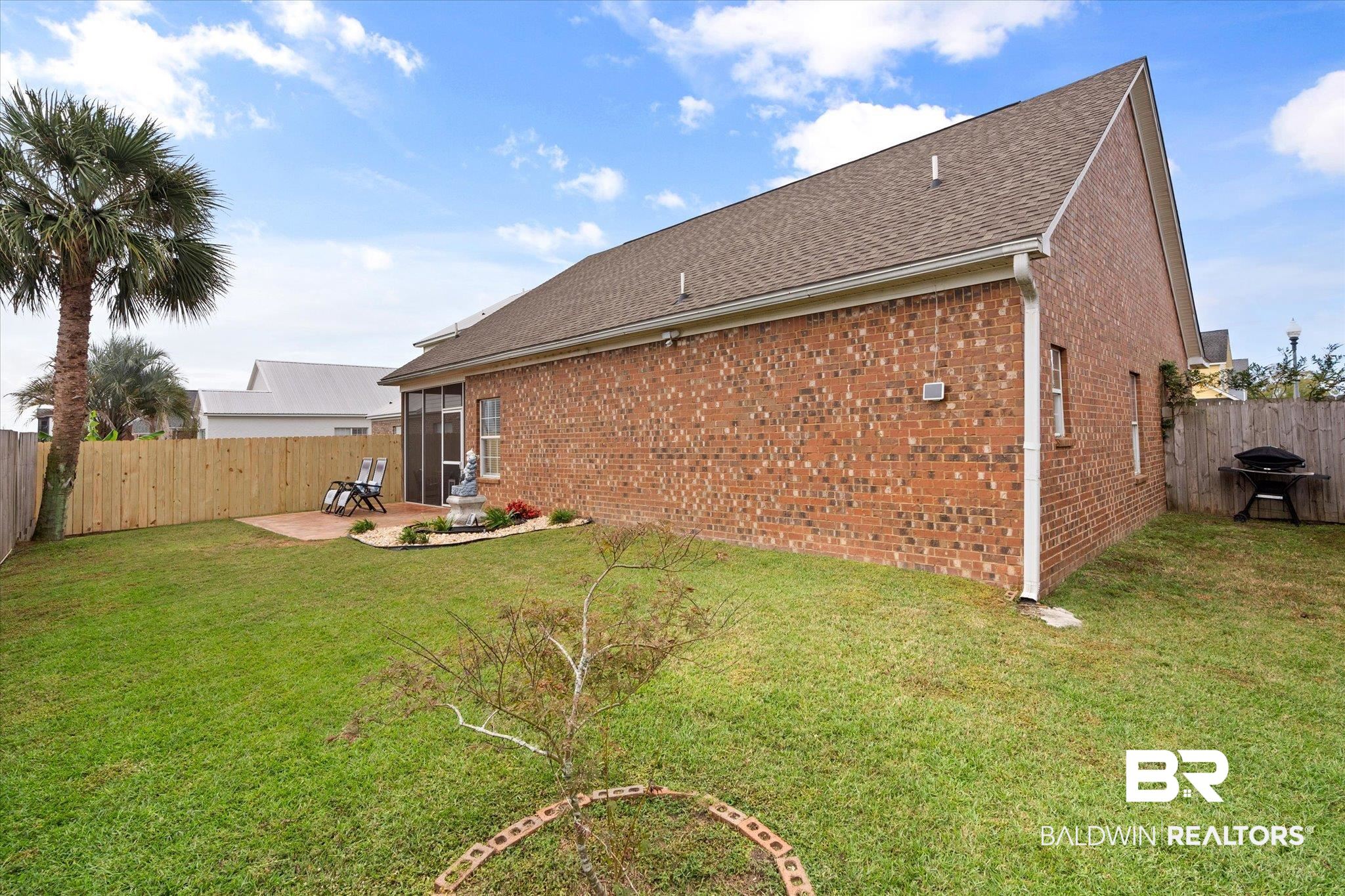 3876 Emerille Drive Foley, AL 36535 - Photo 28 of 31 Back of property with a lawn and a patio area