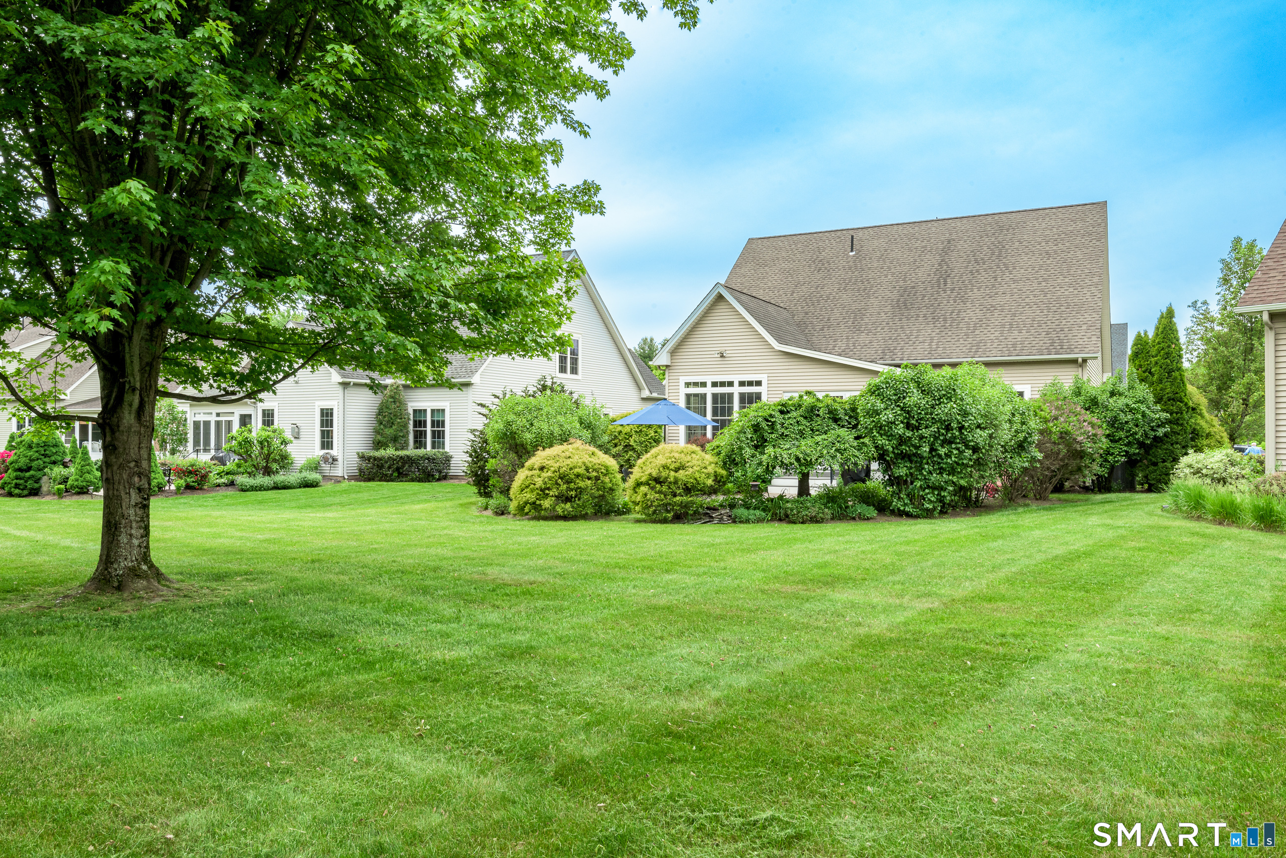 8 Greendale Drive, Unit 8 Suffield, CT 06078 - Photo 34 of 40 a view of a house with a backyard