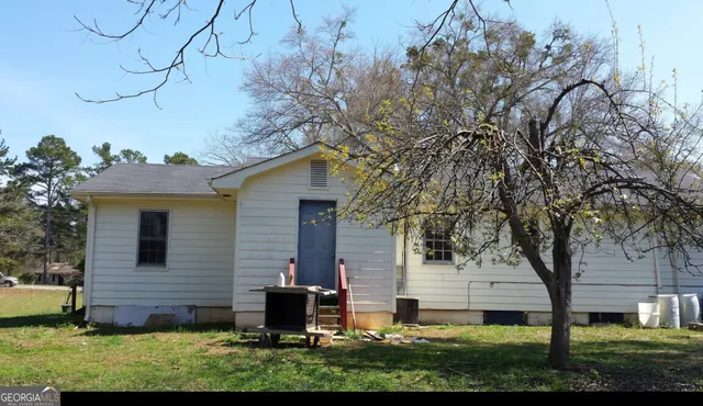 a view of house with yard