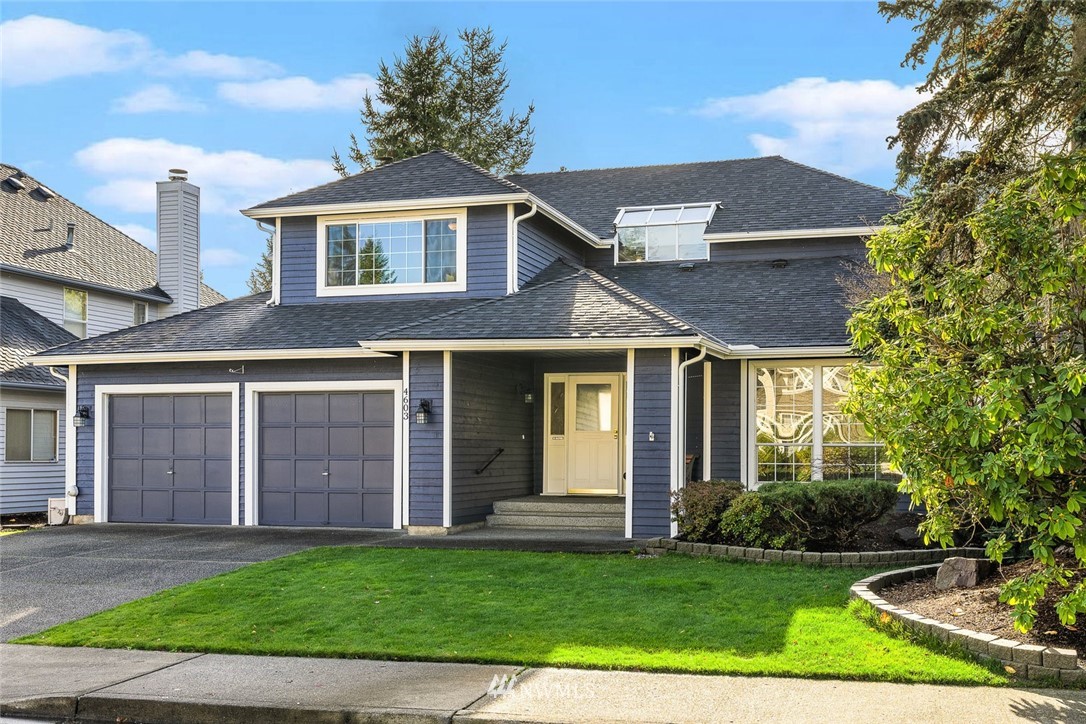 4603 Northeast 19th Street Renton, WA 98059 - Photo 2 of 30 a front view of a house with a garden