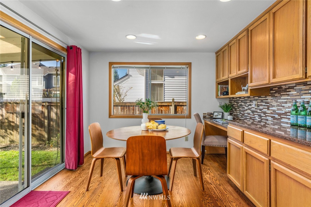 4603 Northeast 19th Street Renton, WA 98059 - Photo 13 of 30 a dining room with furniture and wooden floor