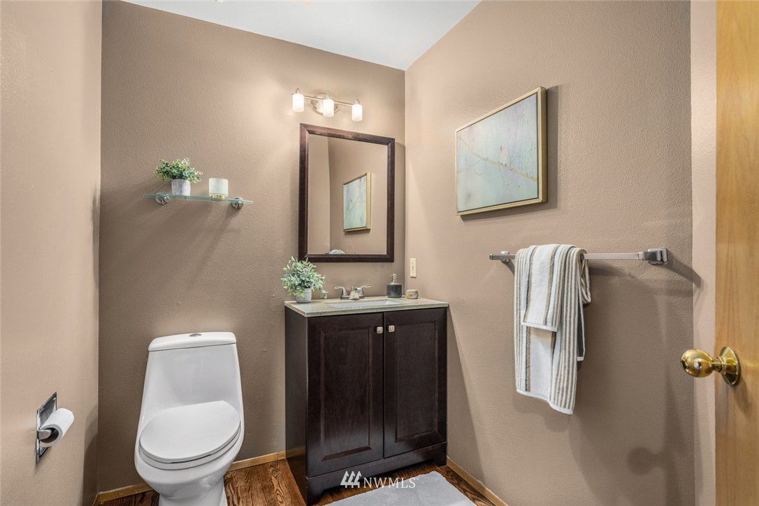 4603 Northeast 19th Street Renton, WA 98059 - Photo 17 of 30 a bathroom with a toilet sink and mirror