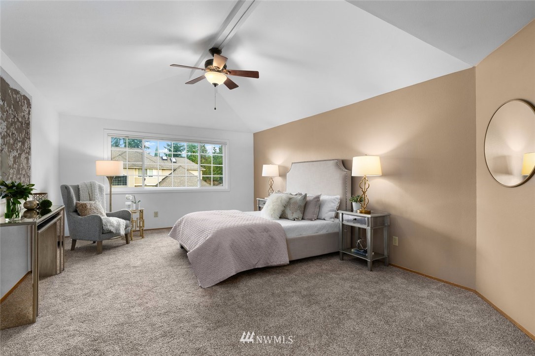 4603 Northeast 19th Street Renton, WA 98059 - Photo 18 of 30 a bed room with a bed and a mirror