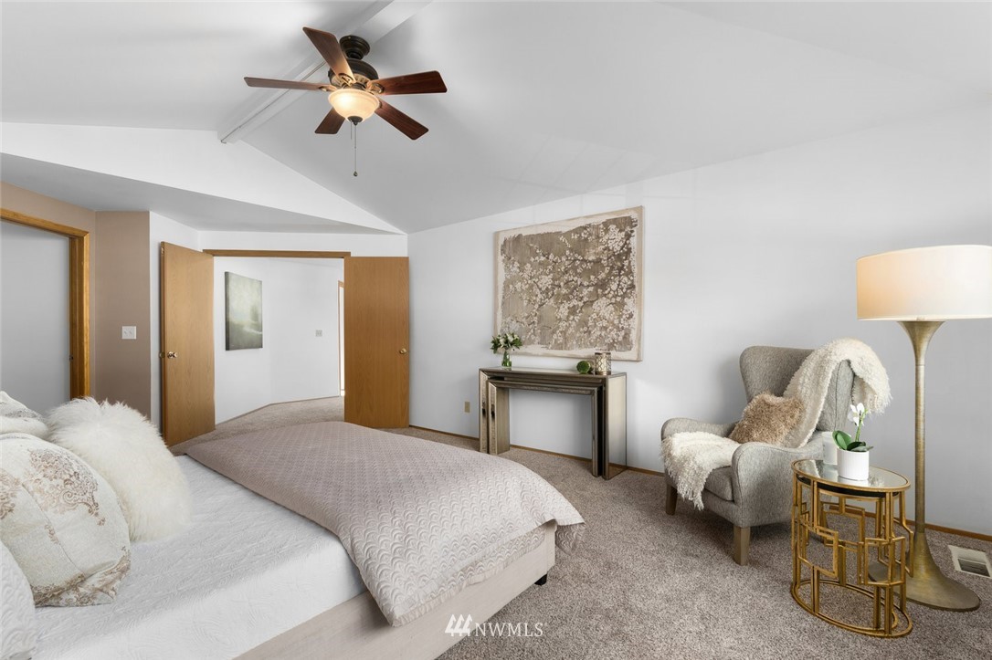 4603 Northeast 19th Street Renton, WA 98059 - Photo 19 of 30 a bedroom with a bed and ceiling fan