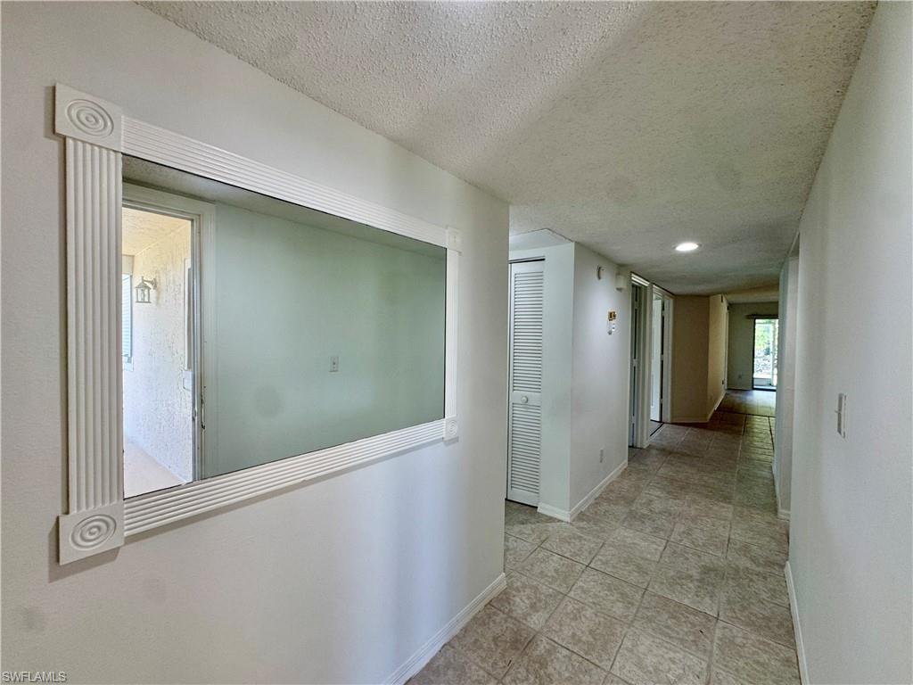 661 Squire Circle, Unit 101 Naples, FL 34104 - Photo 14 of 25 view of hallway