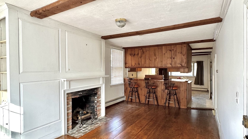18 State Street, Unit 1 Marblehead, MA 01945 - Photo 3 of 16 a view of a dining room with furniture and wooden floor