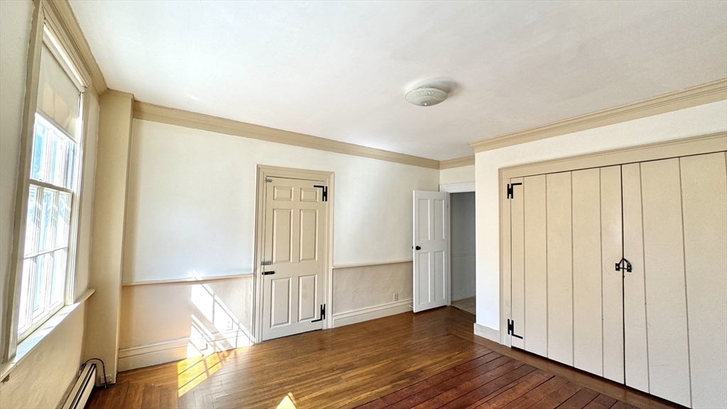 18 State Street, Unit 1 Marblehead, MA 01945 - Photo 8 of 16 a view of entryway with wooden floor