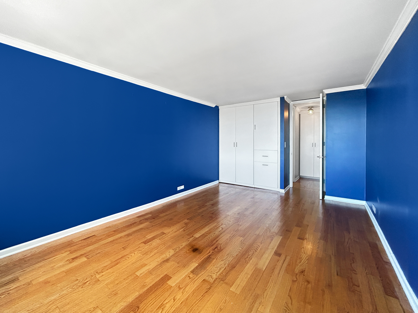 655 West Irving Park Road, Unit 3608 Chicago, IL 60613 - Photo 11 of 20 a view of an empty room with wooden floor