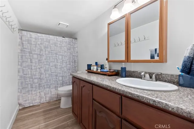 a bed room with a bed and a television