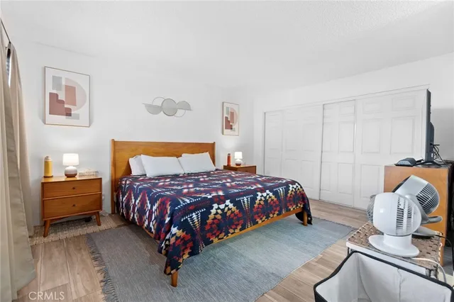 a bathroom with a granite countertop sink mirror vanity and toilet