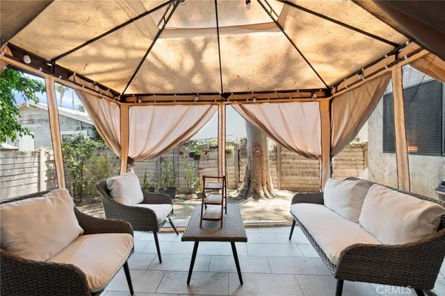 a view of a house with couches and sitting area