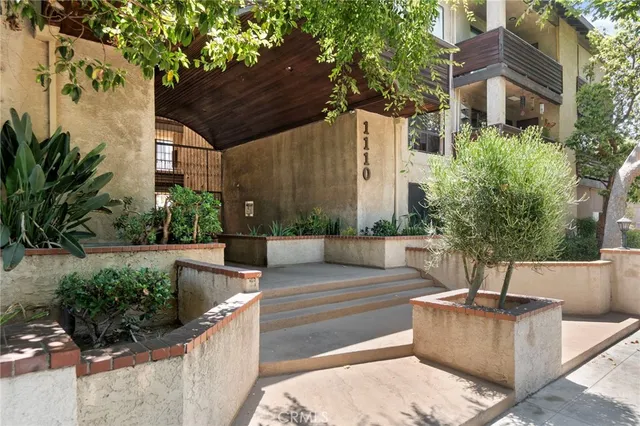 a view of a balcony with iron fence