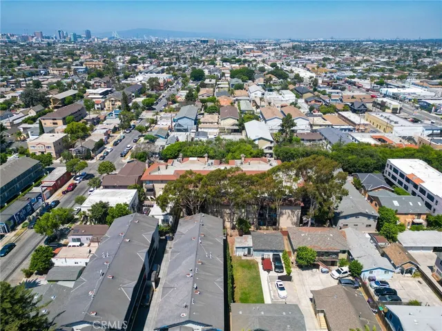 a view of a patio with table and chairs and potted plants