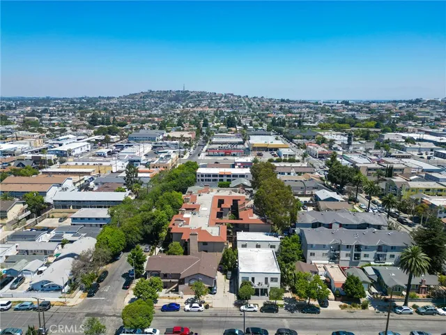 an aerial view of multiple houses with yard