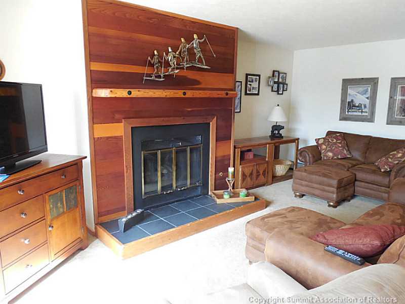 91300 Ryan Gulch Road, Unit 307 Silverthorne, CO 80498 - Photo 7 of 25 Living Room. Family room with gas fireplace