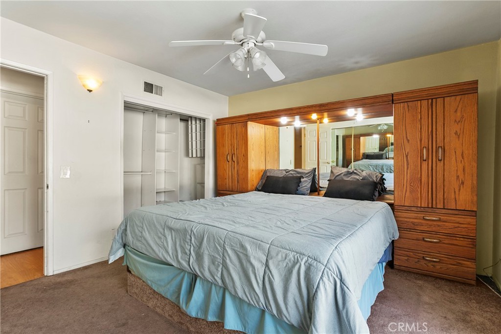 4801 Redbluff Circle Irvine, CA 92604 - Photo 13 of 34 a bedroom with a bed and a chandelier