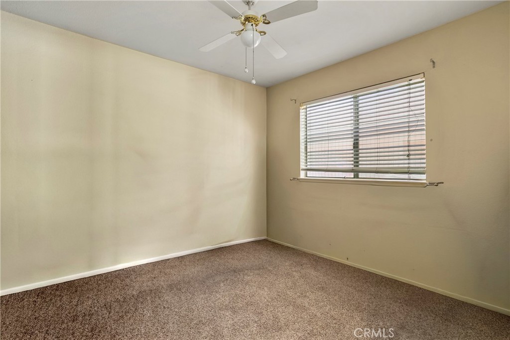 4801 Redbluff Circle Irvine, CA 92604 - Photo 15 of 34 an empty room with a window and a fan