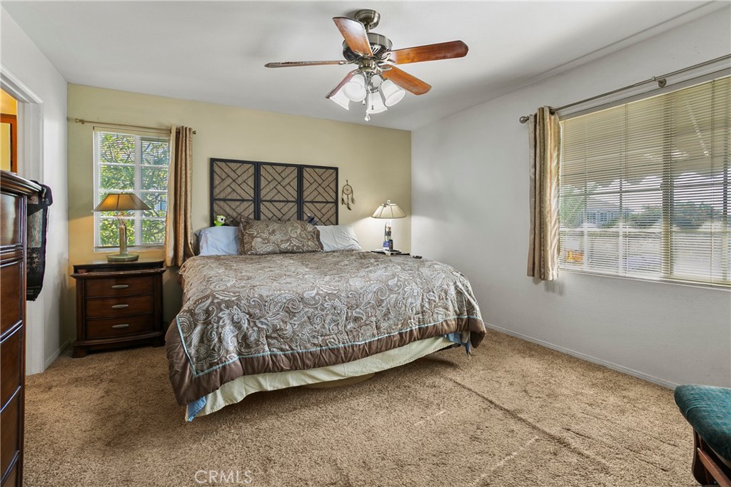 4801 Redbluff Circle Irvine, CA 92604 - Photo 17 of 34 a bedroom with a bed and a chandelier