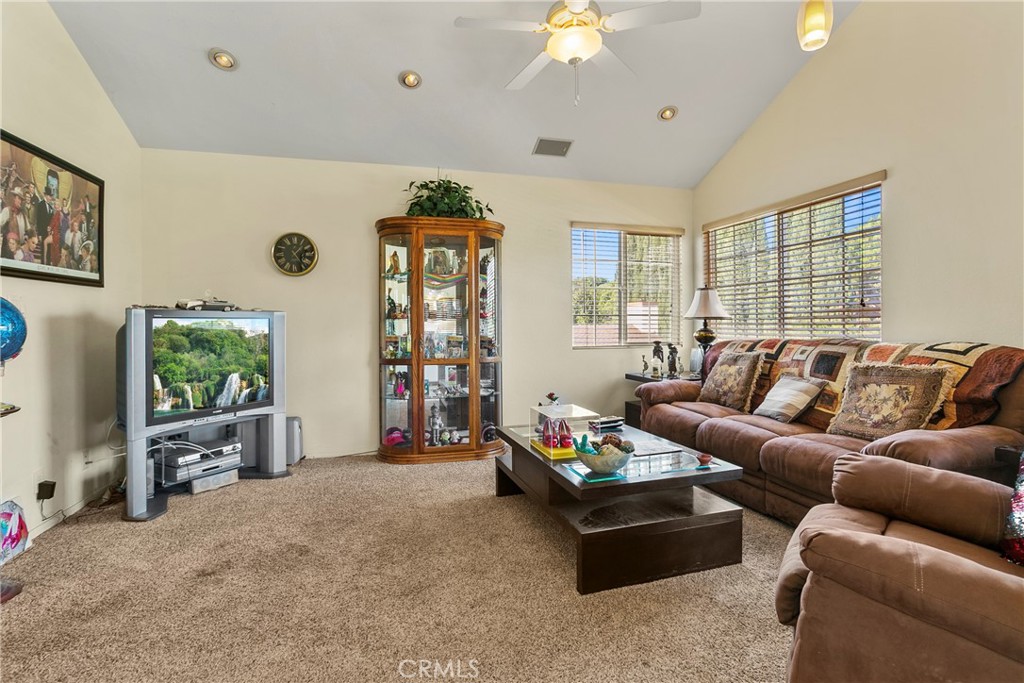 4801 Redbluff Circle Irvine, CA 92604 - Photo 20 of 34 a living room with furniture and a flat screen tv