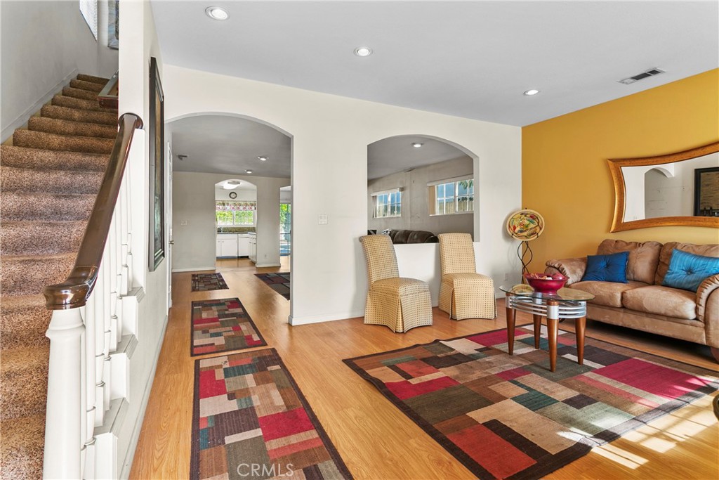 4801 Redbluff Circle Irvine, CA 92604 - Photo 2 of 34 a living room with furniture rug and wooden floor