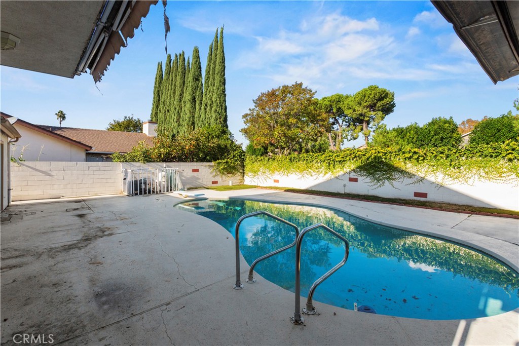 4801 Redbluff Circle Irvine, CA 92604 - Photo 26 of 34 a view of a swimming pool with a yard