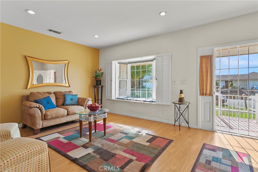 4801 Redbluff Circle Irvine, CA 92604 - Photo 3 of 34 a living room with furniture and a table
