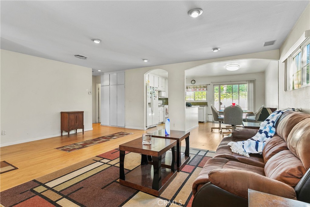 4801 Redbluff Circle Irvine, CA 92604 - Photo 6 of 34 a living room with furniture a table and chairs