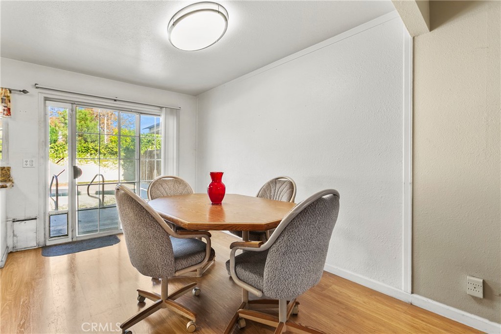 4801 Redbluff Circle Irvine, CA 92604 - Photo 8 of 34 a dining room with furniture and wooden floor