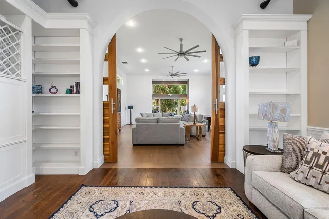 a bathroom with a granite countertop toilet sink and mirror