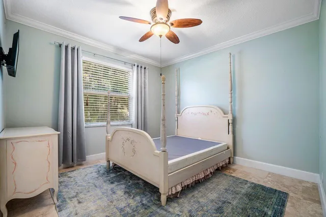 a bathroom with a granite countertop sink mirror vanity and toilet