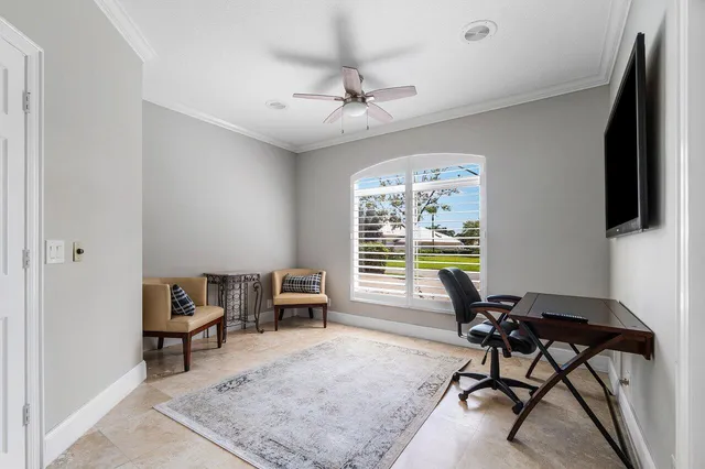 a view of a house with swimming pool and sitting area