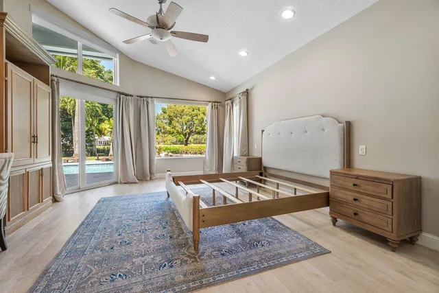 an aerial view of residential houses with outdoor space and street view