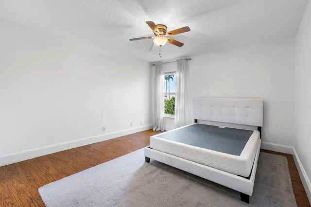 a view of a house with large windows and a fireplace