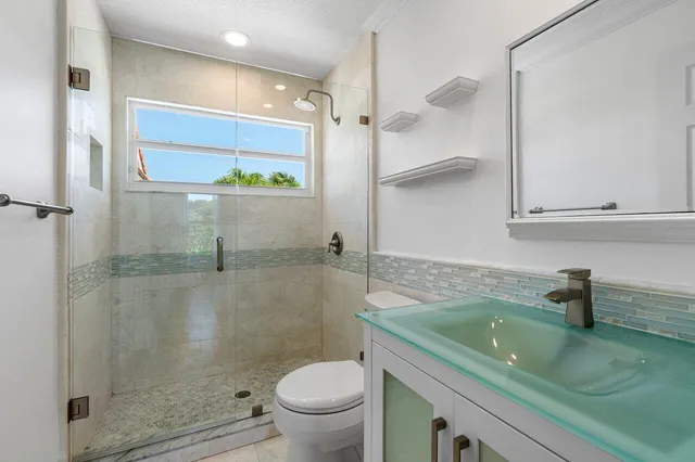 a view of a swimming pool with a table and chairs