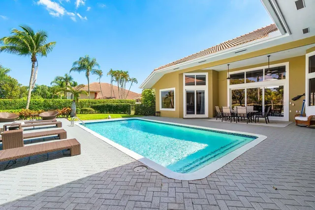 a bedroom with a large bed and a couch
