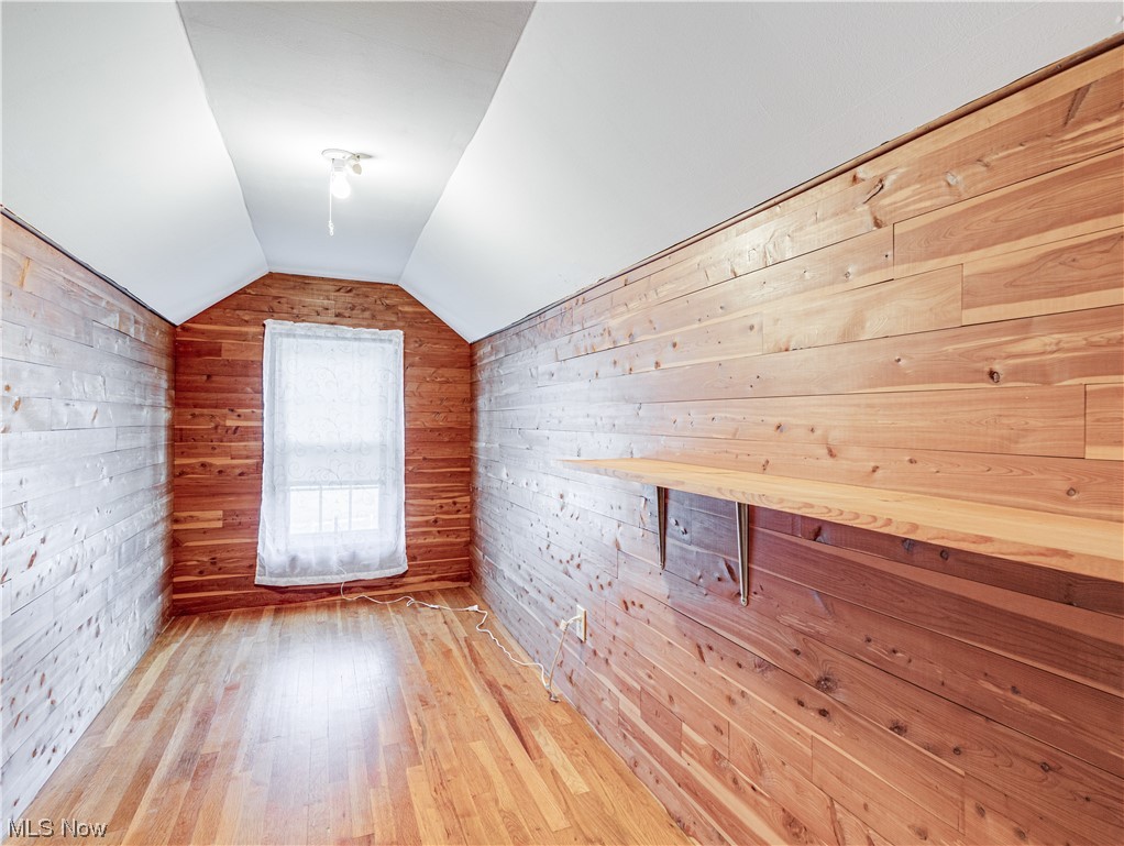 2425 Amesbury Road Akron, OH 44313 - Photo 26 of 42 Additional living space with light hardwood / wood-style flooring and lofted ceiling