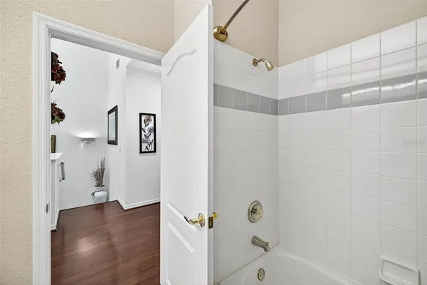 a bathroom with a bathtub and a shower