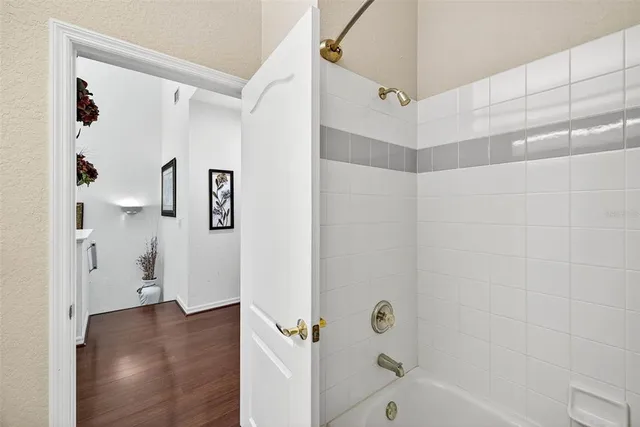 a bathroom with a bathtub and a shower