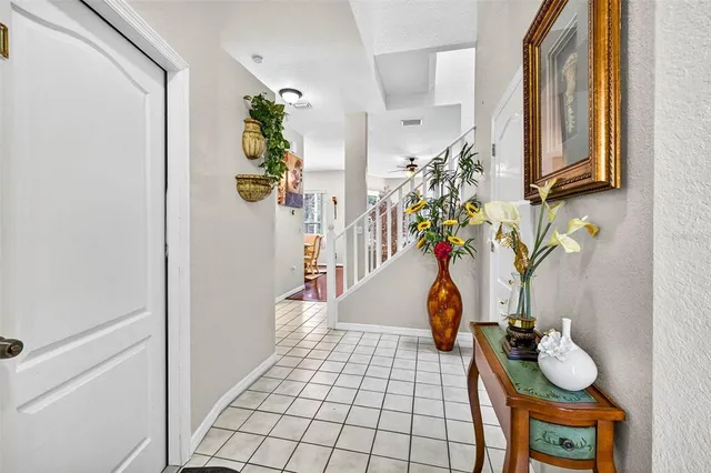 a view of a house with backyard and sitting area
