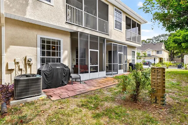 a view of a backyard with sitting area