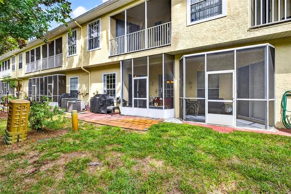 a potted plant sitting in front of a house