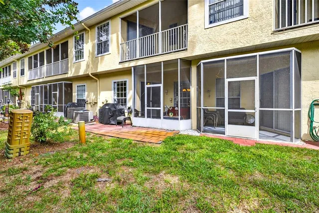 a potted plant sitting in front of a house