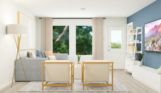 a dining room with furniture and large window
