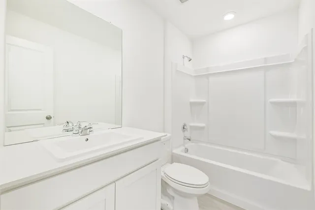 a view of an empty room and a window