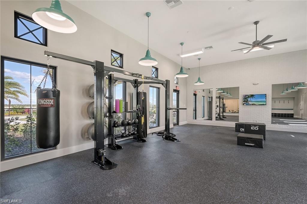 4644 Centaurus Circle Naples, FL 34120 - Photo 37 of 37 Exercise room featuring a high ceiling and a ceiling fan